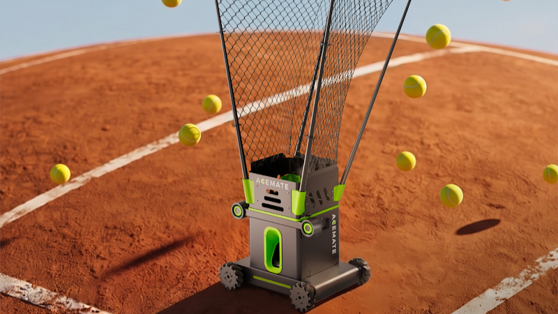 Tennis ball machine with a large ball hopper on a clay court